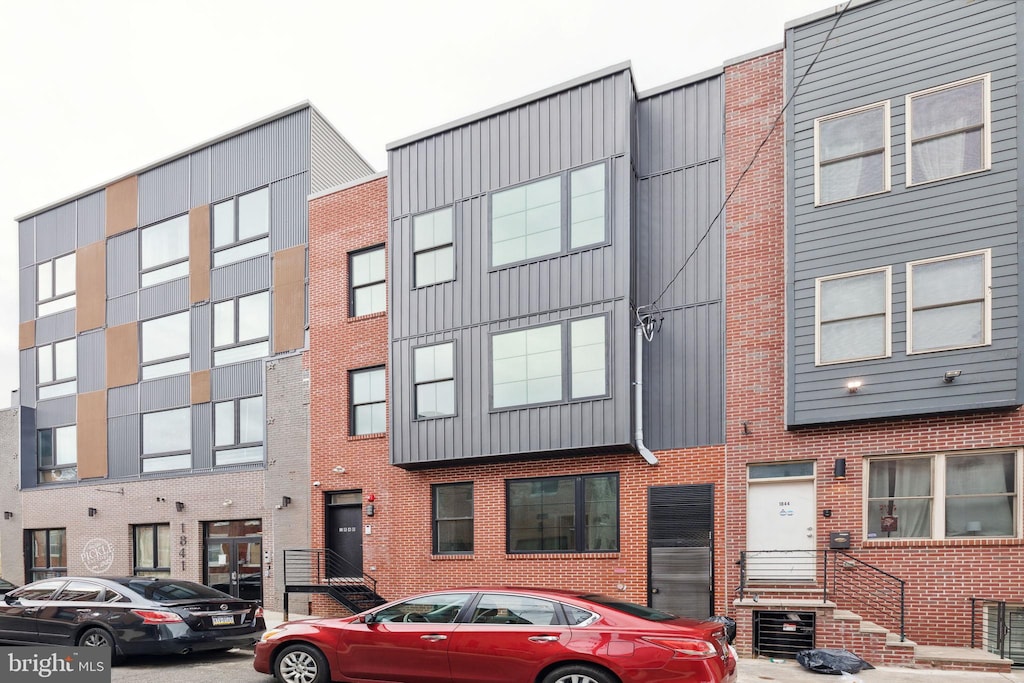 1840 N Gratz St, Philadelphia, PA 19121 - townhome / multi-family property with board and batten siding and brick siding
