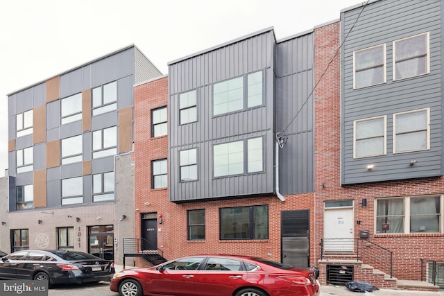 1840 N Gratz St, Philadelphia, PA 19121 - townhome / multi-family property with board and batten siding and brick siding