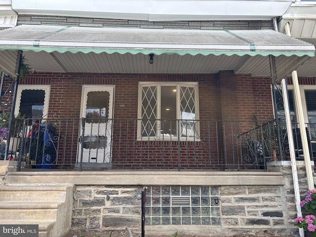 4066 Creston St, Philadelphia, PA 19135 - property entrance with brick siding