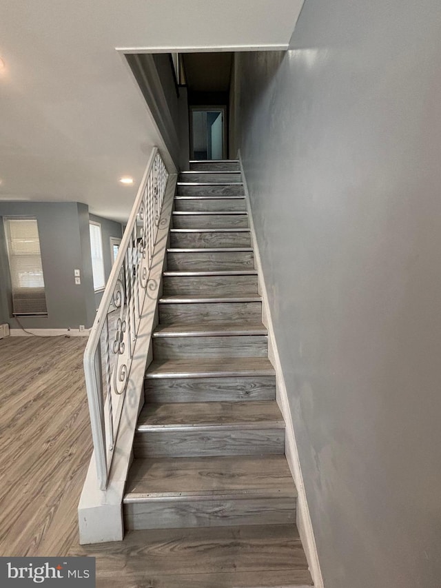 4066 Creston St, Philadelphia, PA 19135 - stairs with wood finished floors and recessed lighting
