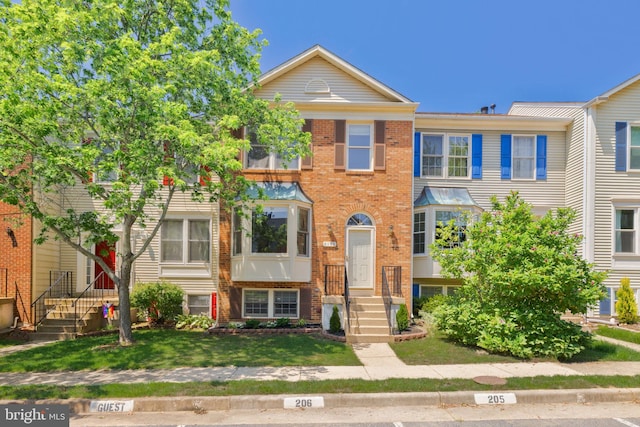6110 Joust Ln, Alexandria, VA 22315 - townhome / multi-family property featuring brick siding and a front yard