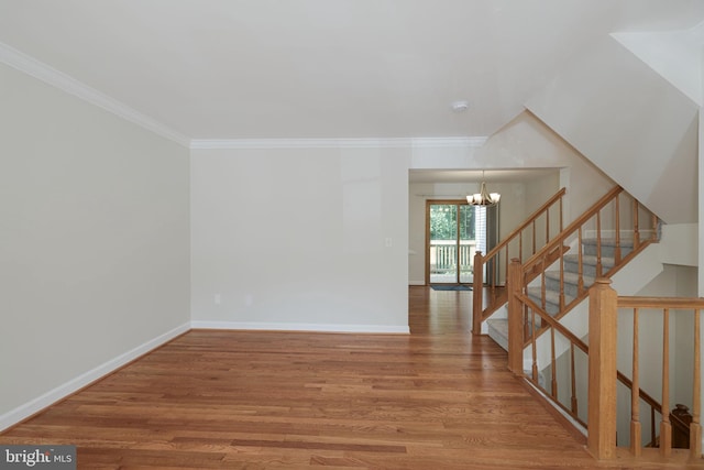 6110 Joust Ln, Alexandria, VA 22315 - unfurnished room featuring a chandelier, wood finished floors, crown molding, and stairway