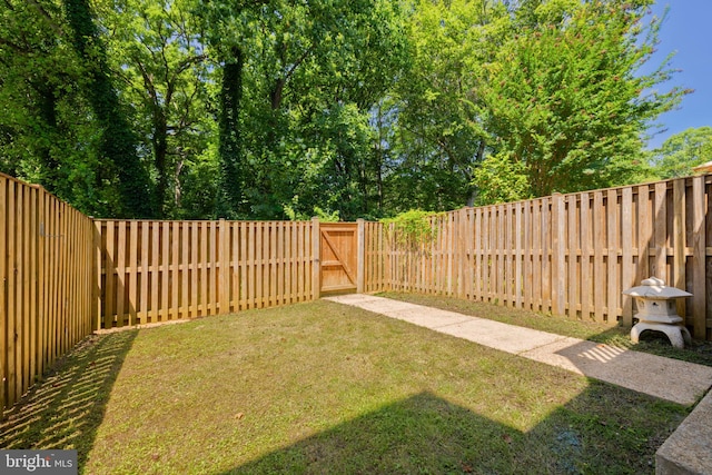 6110 Joust Ln, Alexandria, VA 22315 - fenced backyard featuring a gate