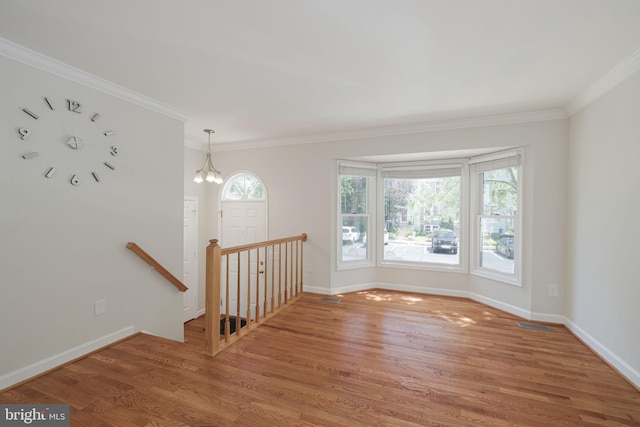 6110 Joust Ln, Alexandria, VA 22315 - unfurnished room featuring light wood-style floors, ornamental molding, and a chandelier