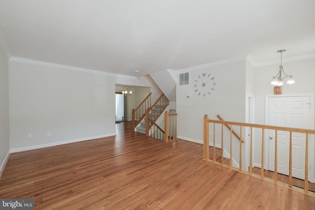 6110 Joust Ln, Alexandria, VA 22315 - unfurnished room featuring a chandelier, light wood-type flooring, ornamental molding, and stairway