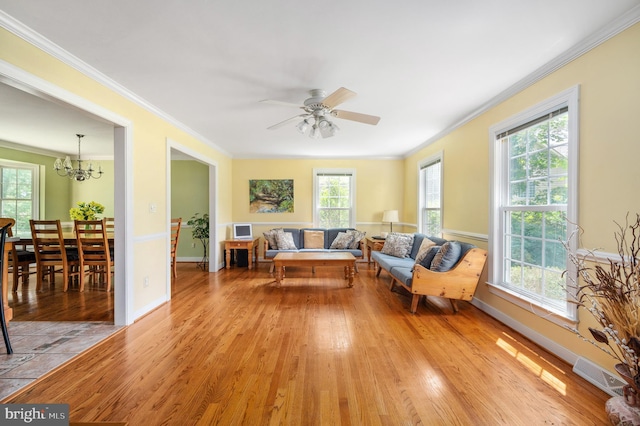 15 Tally Ho Dr, Fredericksburg, VA 22405 - living area with ornamental molding, light wood finished floors, a chandelier, and a ceiling fan