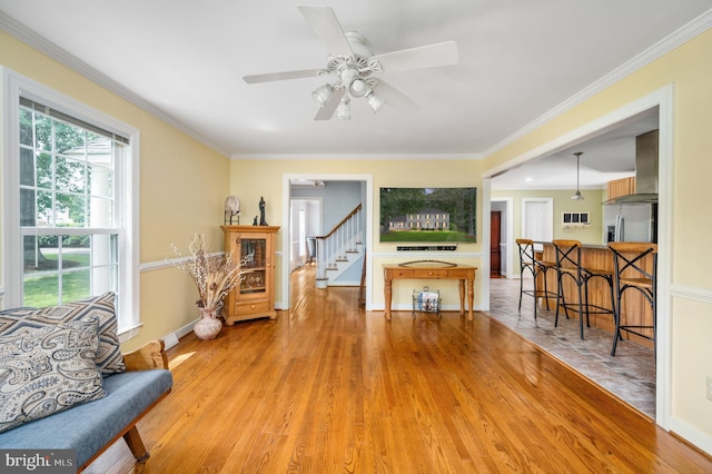 15 Tally Ho Dr, Fredericksburg, VA 22405 - living area with light wood-style flooring, stairway, ceiling fan, and ornamental molding