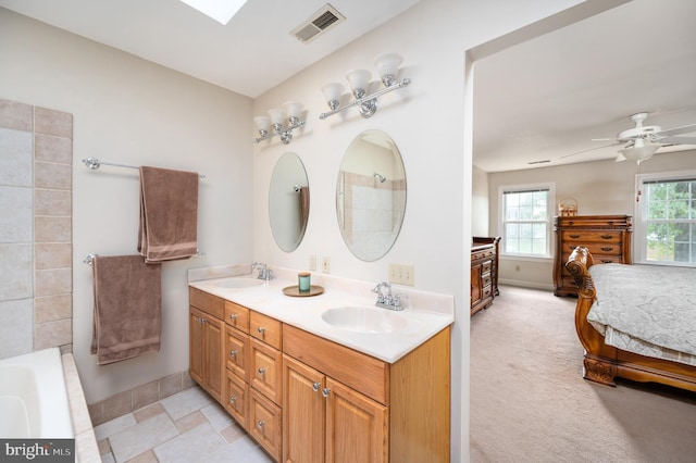 15 Tally Ho Dr, Fredericksburg, VA 22405 - ensuite bathroom with double vanity, a tub to relax in, and ceiling fan