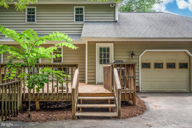 15 Tally Ho Dr, Fredericksburg, VA 22405 - entrance to property with an attached garage, roof with shingles, a wooden deck, and driveway