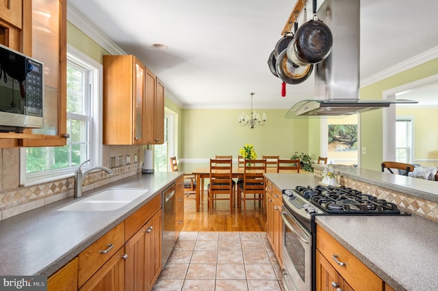 15 Tally Ho Dr, Fredericksburg, VA 22405 - kitchen with stainless steel appliances, healthy amount of natural light, island range hood, brown cabinetry, and crown molding