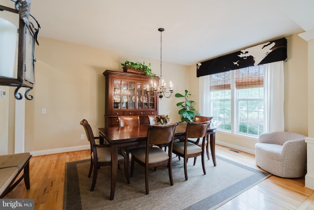 56 Willow Grove Mill Dr, Middletown, DE 19709 - dining area featuring light wood-type flooring and a chandelier
