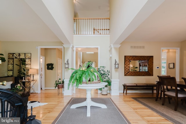 56 Willow Grove Mill Dr, Middletown, DE 19709 - foyer with wood finished floors, decorative columns, and a high ceiling