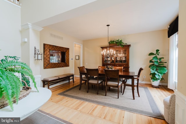 56 Willow Grove Mill Dr, Middletown, DE 19709 - dining area featuring wood finished floors and a chandelier