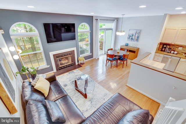 21 Viburnum Ct, Lafayette Hill, PA 19444 - living room featuring light wood-style floors, recessed lighting, and a fireplace with flush hearth