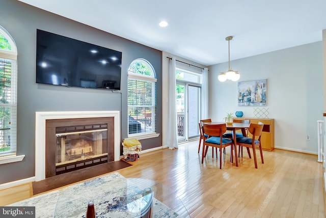 21 Viburnum Ct, Lafayette Hill, PA 19444 - dining area featuring a fireplace with flush hearth, wood finished floors, and recessed lighting