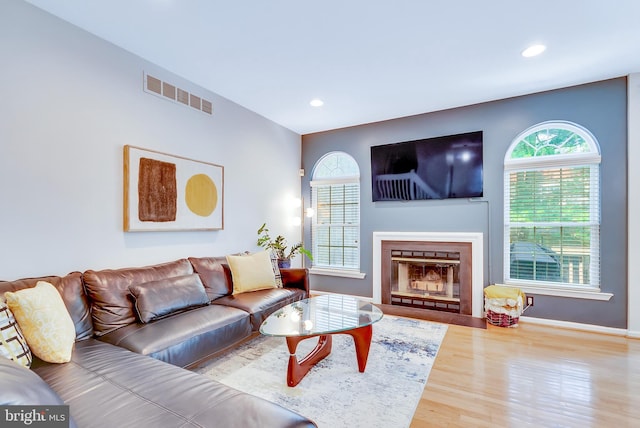 21 Viburnum Ct, Lafayette Hill, PA 19444 - living room featuring wood finished floors, recessed lighting, and a glass covered fireplace