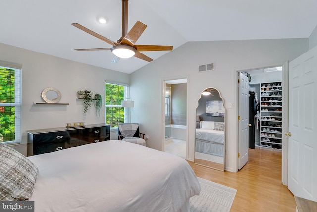 21 Viburnum Ct, Lafayette Hill, PA 19444 - bedroom with vaulted ceiling, a walk in closet, light wood finished floors, connected bathroom, and ceiling fan