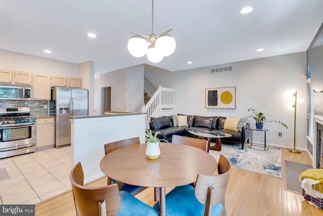 21 Viburnum Ct, Lafayette Hill, PA 19444 - dining area with stairs, light wood-type flooring, recessed lighting, and a chandelier