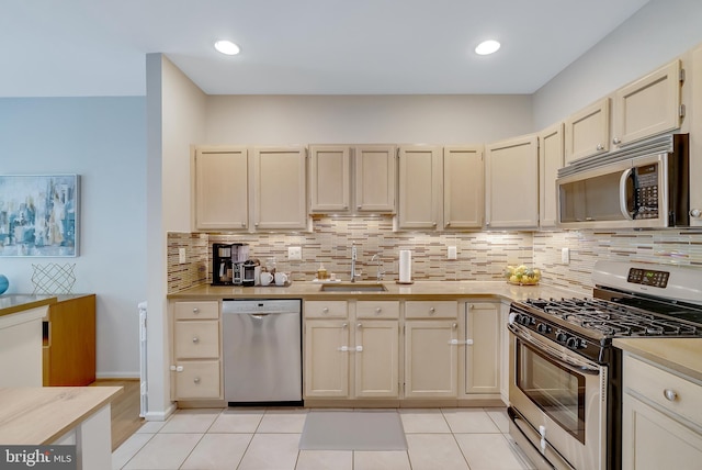 21 Viburnum Ct, Lafayette Hill, PA 19444 - kitchen with appliances with stainless steel finishes, light countertops, tasteful backsplash, light tile patterned flooring, and recessed lighting