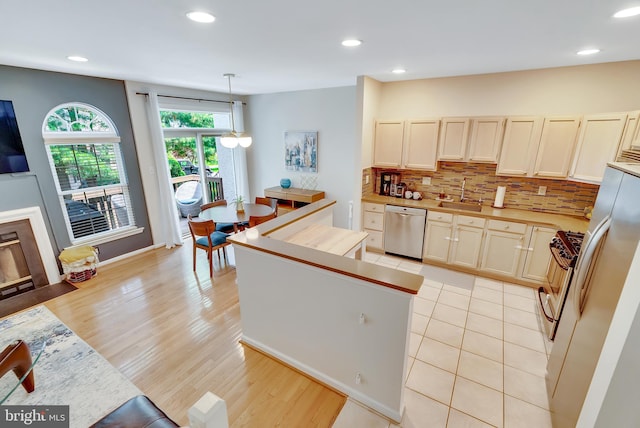 21 Viburnum Ct, Lafayette Hill, PA 19444 - kitchen featuring dishwasher, light countertops, decorative backsplash, a kitchen island, and recessed lighting
