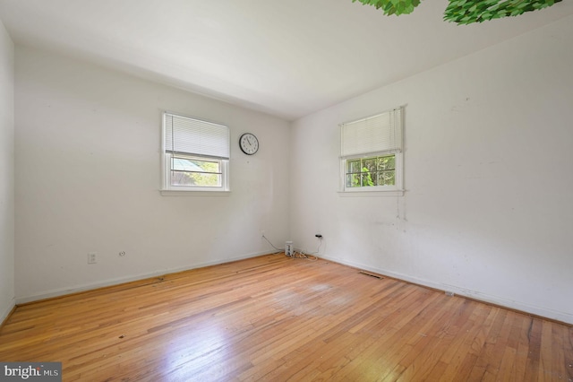 609 Apple Rd, Newark, DE 19711 - spare room with healthy amount of natural light and light wood finished floors