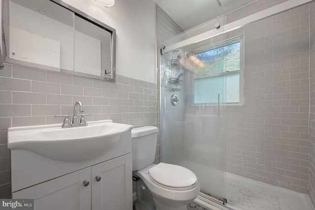 609 Apple Rd, Newark, DE 19711 - bathroom featuring tile walls, a shower stall, vanity, and decorative backsplash