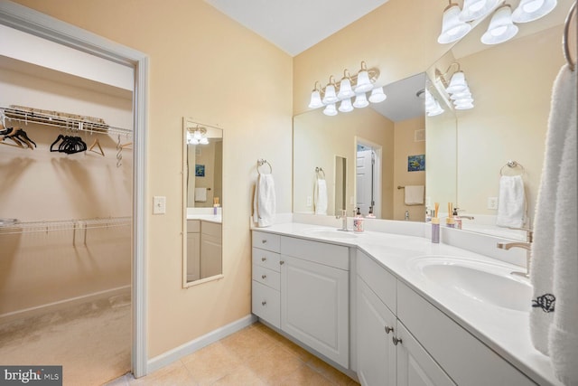 7 Booth St Unit 202, Gaithersburg, MD 20878 - bathroom with double vanity, tile patterned floors, and a walk in closet