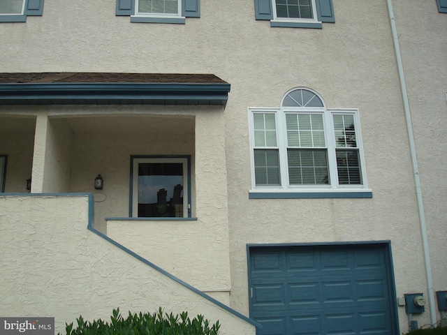 1704 Stoneham Dr, West Chester, PA 19382 - view of home's exterior with a garage and stucco siding