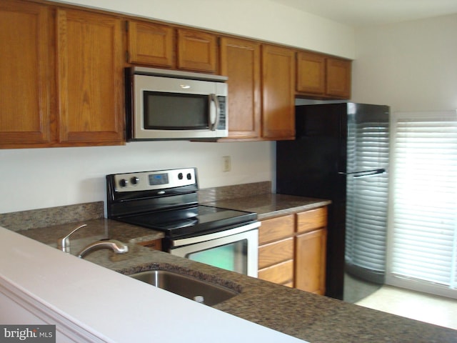 1704 Stoneham Dr, West Chester, PA 19382 - kitchen featuring appliances with stainless steel finishes and brown cabinetry