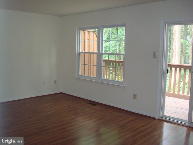 1704 Stoneham Dr, West Chester, PA 19382 - empty room with dark wood-style floors and healthy amount of natural light