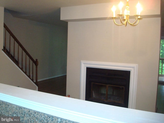 1704 Stoneham Dr, West Chester, PA 19382 - stairs featuring a chandelier and a glass covered fireplace