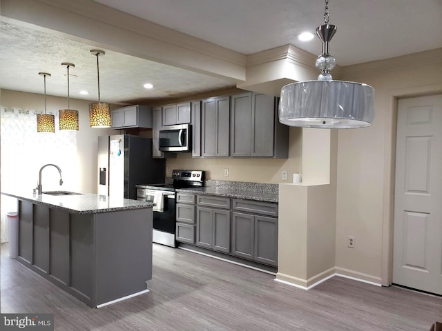 15021 Mcknew Rd, Burtonsville, MD 20866 - kitchen with stainless steel appliances, gray cabinets, light stone counters, recessed lighting, and light wood-style floors