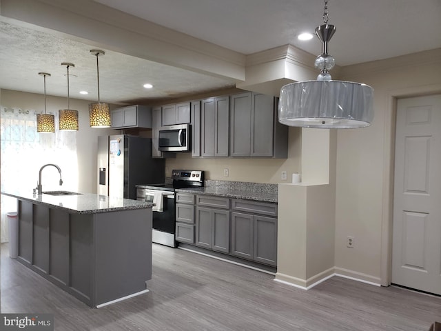 15021 Mcknew Rd, Burtonsville, MD 20866 - kitchen with appliances with stainless steel finishes, gray cabinets, recessed lighting, light stone counters, and light wood-style flooring