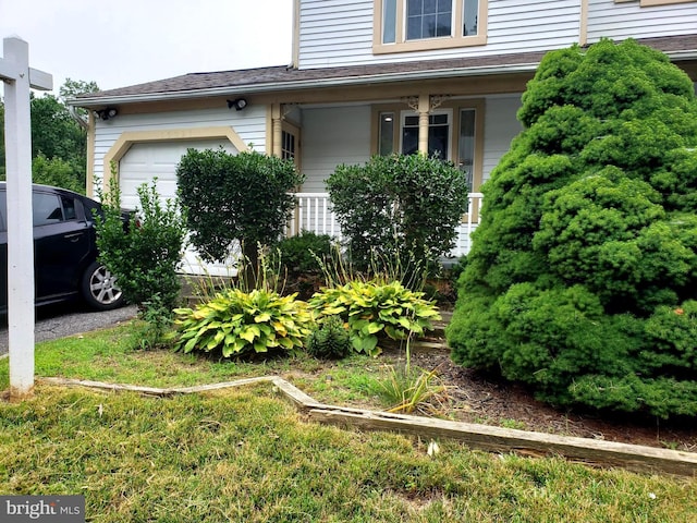 15021 Mcknew Rd, Burtonsville, MD 20866 - view of home's exterior with an attached garage and covered porch