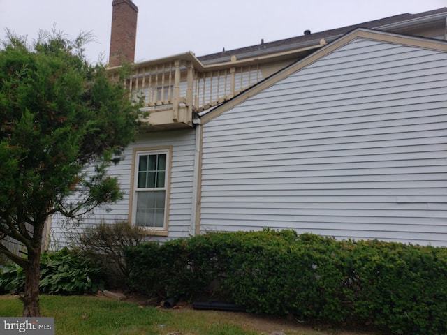 15021 Mcknew Rd, Burtonsville, MD 20866 - view of home's exterior featuring a balcony and a chimney