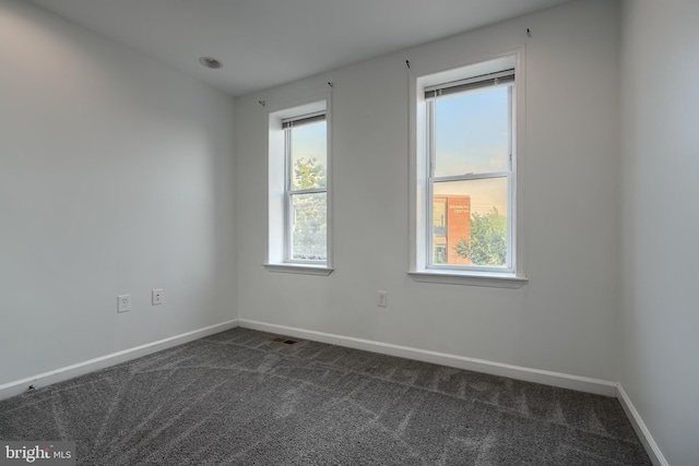 930 Washington Blvd, Baltimore, MD 21230 - empty room featuring healthy amount of natural light and dark carpet