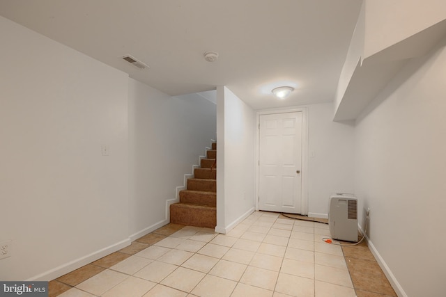 930 Washington Blvd, Baltimore, MD 21230 - finished below grade area featuring light tile patterned floors and stairs