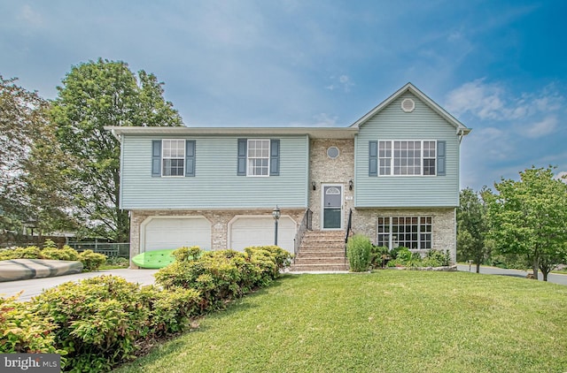 75 Westminster Dr, Front Royal, VA 22630 - split foyer home with an attached garage, a front yard, brick siding, and concrete driveway