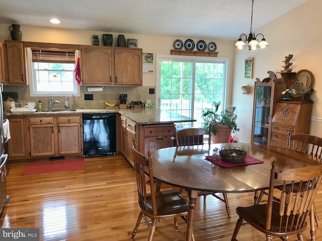 75 Westminster Dr, Front Royal, VA 22630 - kitchen with black dishwasher, light wood-style floors, tasteful backsplash, a peninsula, and brown cabinets
