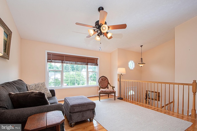 75 Westminster Dr, Front Royal, VA 22630 - living area featuring a ceiling fan, wood finished floors, vaulted ceiling, and an upstairs landing