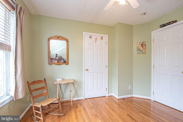 75 Westminster Dr, Front Royal, VA 22630 - living area with light wood-type flooring, ceiling fan, and a textured ceiling