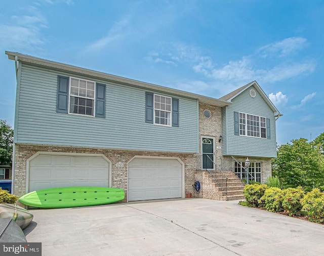 75 Westminster Dr, Front Royal, VA 22630 - split foyer home featuring driveway, a garage, and stone siding