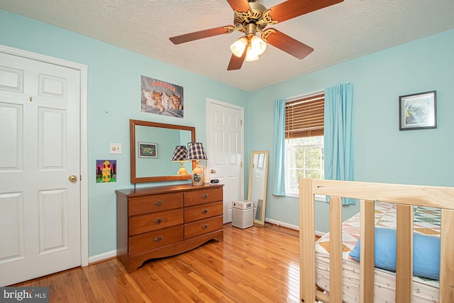 75 Westminster Dr, Front Royal, VA 22630 - bedroom featuring light wood-style floors, a textured ceiling, and ceiling fan