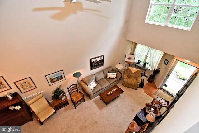 1015 Greenes Way Cir, Collegeville, PA 19426 - living room with a towering ceiling, ceiling fan, and carpet flooring