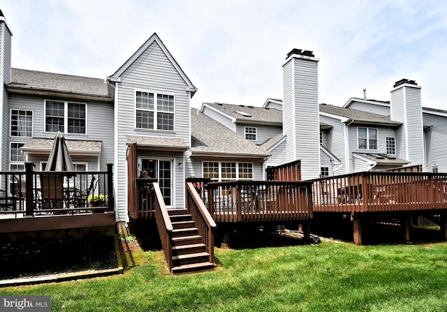 1015 Greenes Way Cir, Collegeville, PA 19426 - rear view of house with a wooden deck, a yard, and roof with shingles