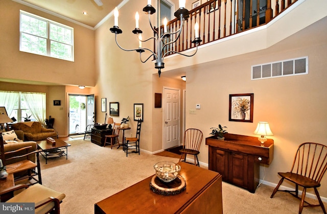 1015 Greenes Way Cir, Collegeville, PA 19426 - living area with a high ceiling, carpet, crown molding, and a chandelier