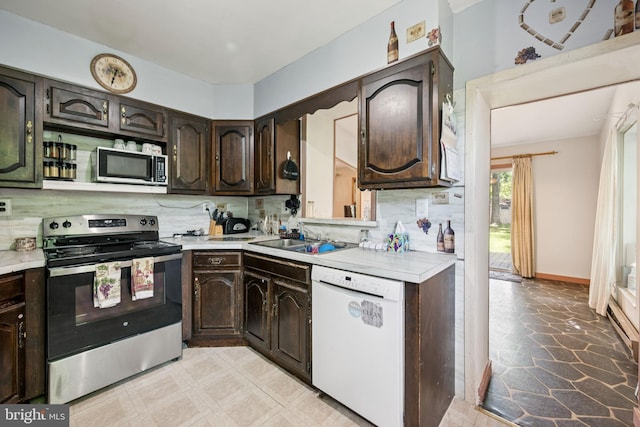 515 N Walnut Ave, Magnolia, NJ 08049 - kitchen with appliances with stainless steel finishes, light countertops, backsplash, and dark brown cabinets