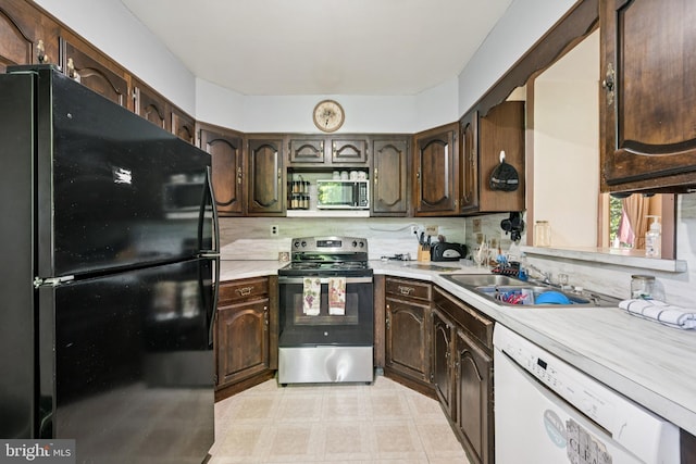 515 N Walnut Ave, Magnolia, NJ 08049 - kitchen featuring stainless steel appliances, light countertops, dark brown cabinetry, light floors, and tasteful backsplash