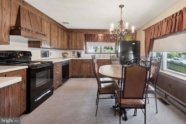 301 W Marshall St, West Chester, PA 19380 - kitchen with black appliances, a chandelier, light countertops, custom range hood, and hanging light fixtures