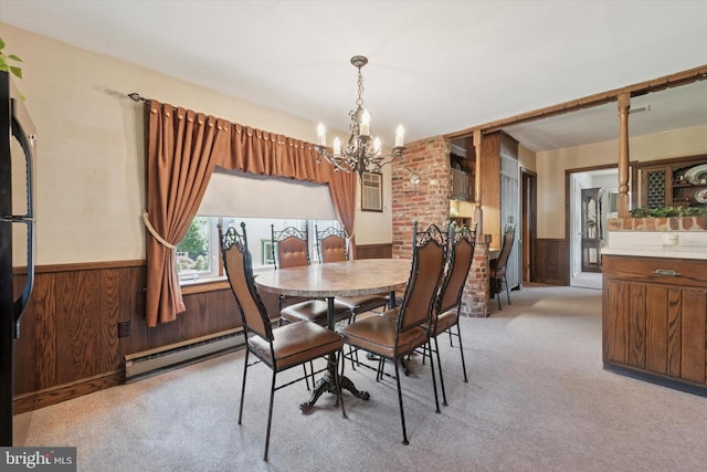 301 W Marshall St, West Chester, PA 19380 - dining space with a chandelier, wainscoting, baseboard heating, light colored carpet, and wood walls